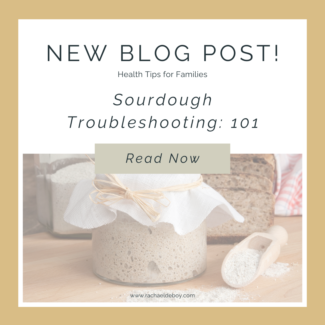 "Jar of active sourdough starter with fresh bread and flour, symbolizing sourdough baking and troubleshooting solutions."