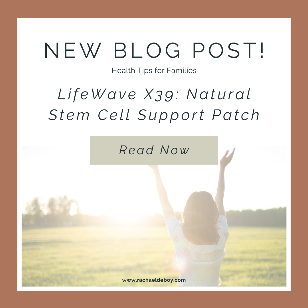 Woman with arms raised in a sunlit field, representing health and vitality from LifeWave X39 stem cell patch.
