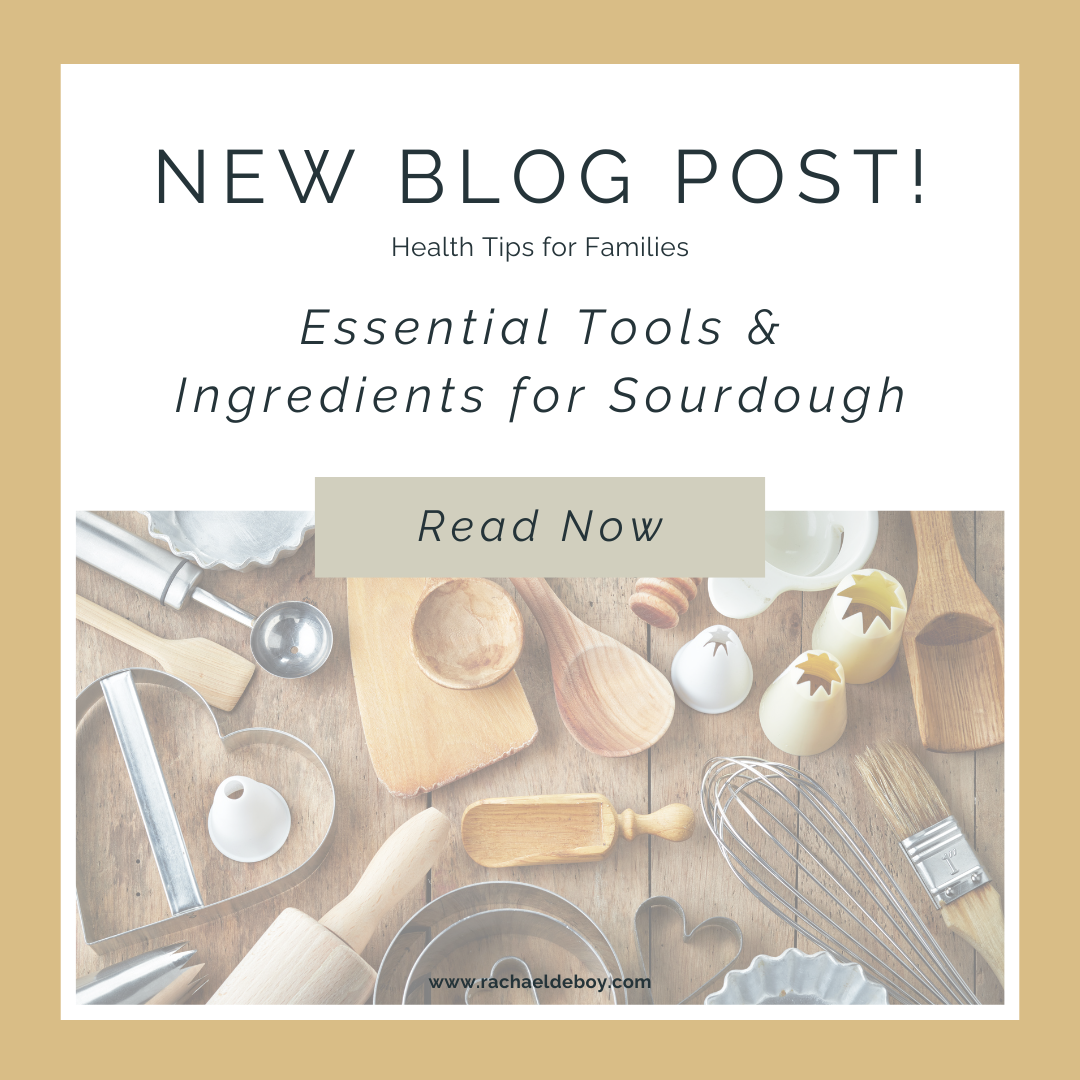 Flat lay of sourdough baking tools and ingredients, including rolling pins, whisks, and wooden spoons, for Rachael DeBoy Wellness blog.