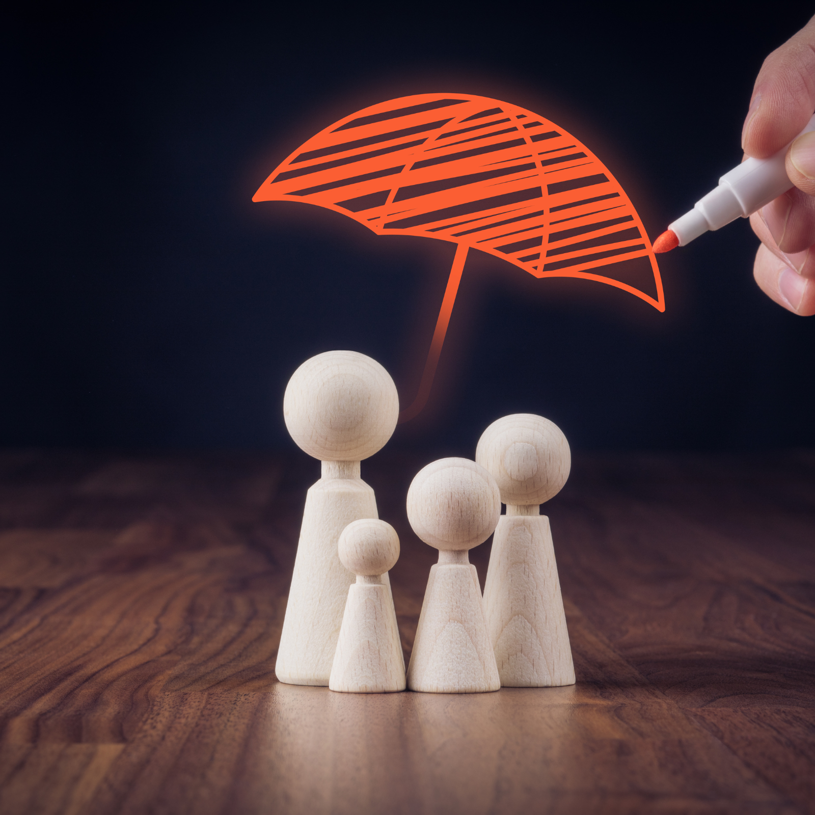 Wooden figurines representing a family under a red umbrella illustration symbolizing insurance protection.